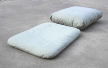 Zabutons are the cushions that can be used under Zafu's, shown new and broken in.