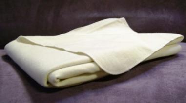 These 100% wool pads protect the mattress and wick any moisture away from baby!